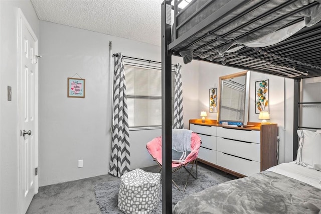 carpeted bedroom with a textured ceiling