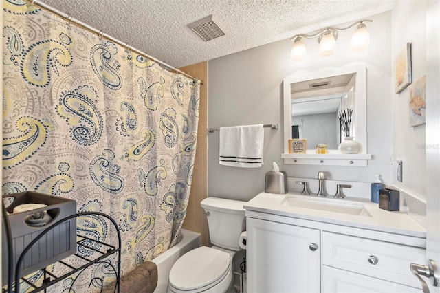 full bathroom with vanity, toilet, a textured ceiling, and shower / tub combo with curtain