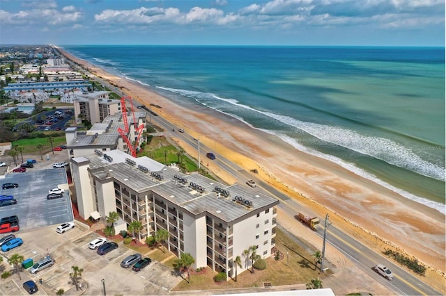 aerial view featuring a water view and a beach view