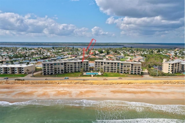 aerial view featuring a water view and a view of the beach