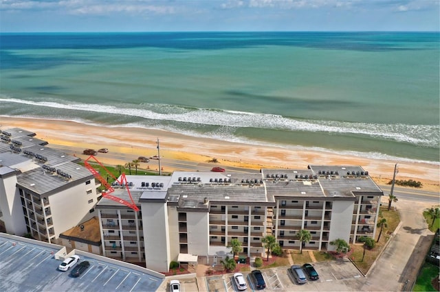 aerial view with a beach view and a water view