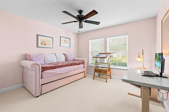 living room featuring a ceiling fan, carpet, and baseboards