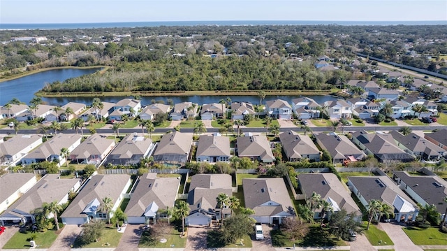 aerial view featuring a water view and a residential view