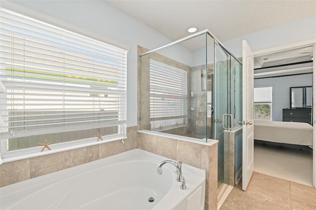 ensuite bathroom with a stall shower, tile patterned floors, a garden tub, and ensuite bathroom