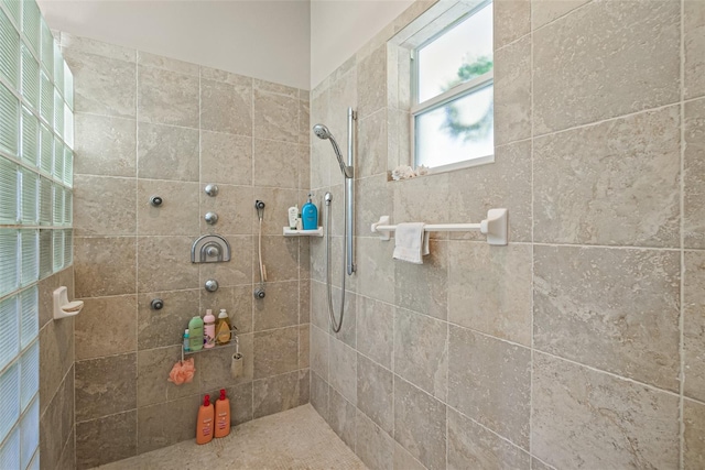 bathroom with tiled shower