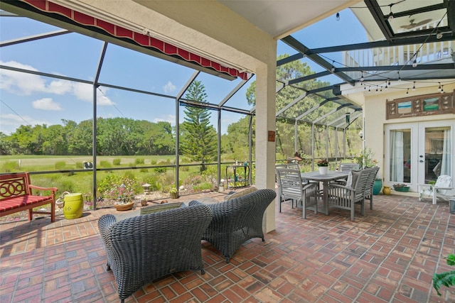 view of patio with french doors and glass enclosure