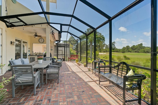 view of patio / terrace with an outdoor living space, ceiling fan, and a lanai