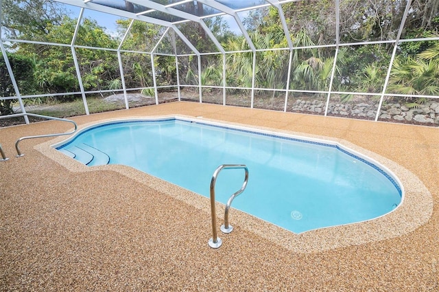 view of swimming pool with glass enclosure