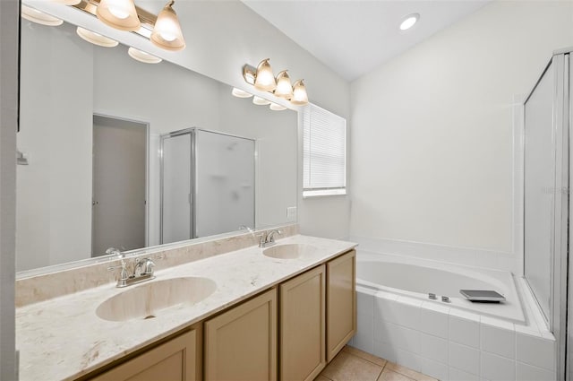 bathroom with tile patterned floors, vanity, and plus walk in shower