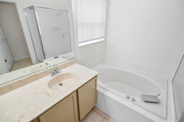 bathroom with tile patterned floors, vanity, and independent shower and bath