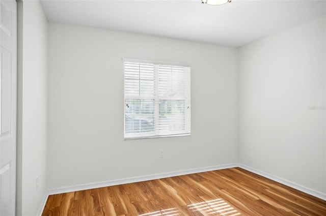 spare room featuring hardwood / wood-style floors