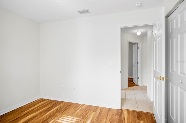 unfurnished room featuring light hardwood / wood-style floors