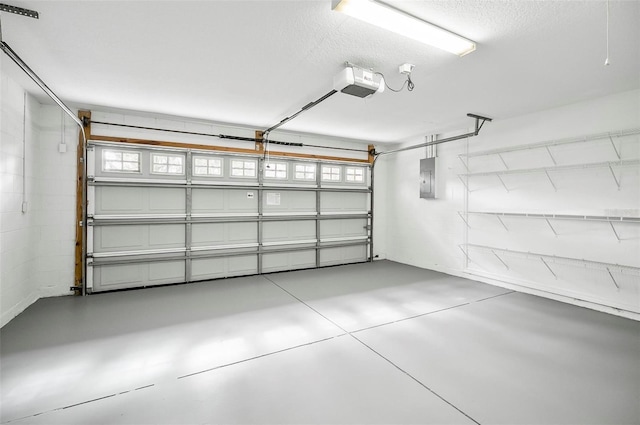 garage featuring electric panel and a garage door opener