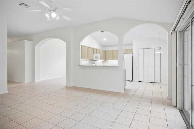 unfurnished room featuring ceiling fan, lofted ceiling, and light tile patterned flooring