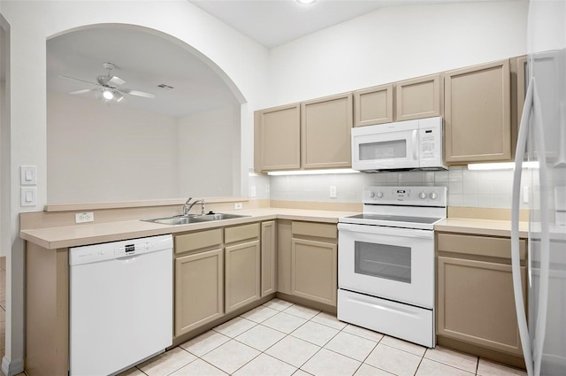 kitchen with tasteful backsplash, white appliances, ceiling fan, sink, and light tile patterned floors