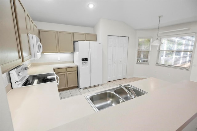 kitchen with kitchen peninsula, sink, white appliances, and hanging light fixtures