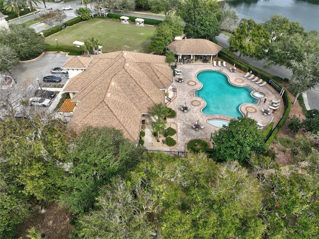 birds eye view of property with a water view