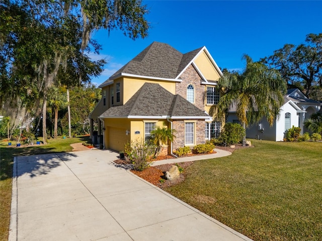 traditional-style home featuring stone siding, a shingled roof, a front lawn, and stucco siding