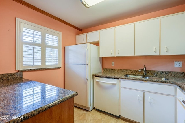 kitchen with dark stone counters, dishwashing machine, sink, white refrigerator, and white cabinets