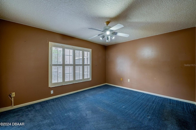 unfurnished room with ceiling fan, carpet floors, and a textured ceiling