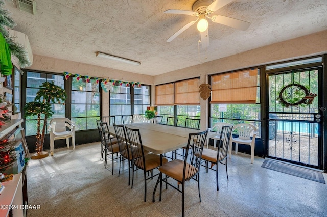 sunroom featuring ceiling fan