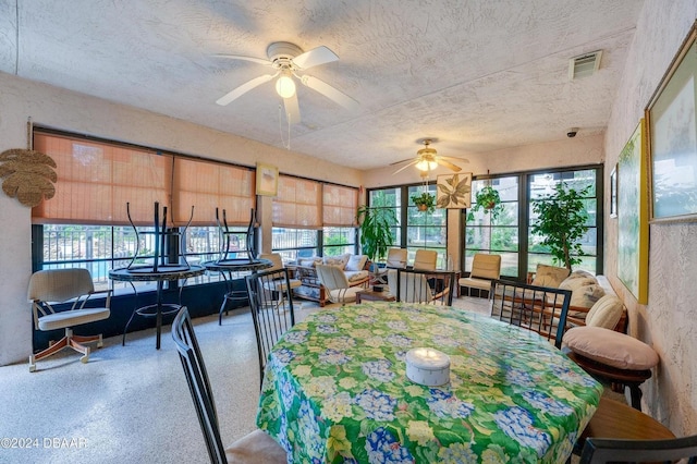 sunroom / solarium with ceiling fan