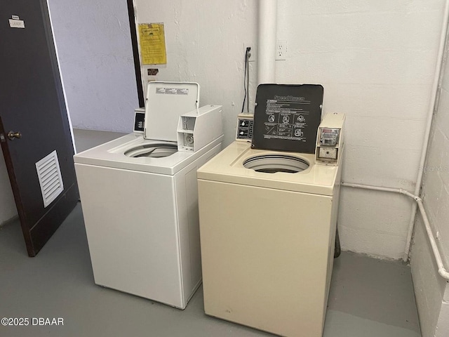 laundry room featuring washer and clothes dryer