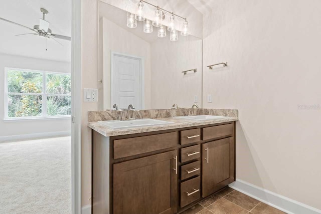 bathroom featuring ceiling fan and vanity