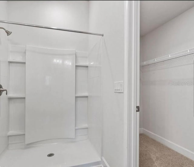 bathroom featuring walk in shower