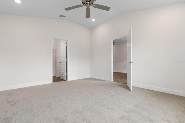 unfurnished bedroom featuring recessed lighting, visible vents, lofted ceiling, and carpet floors