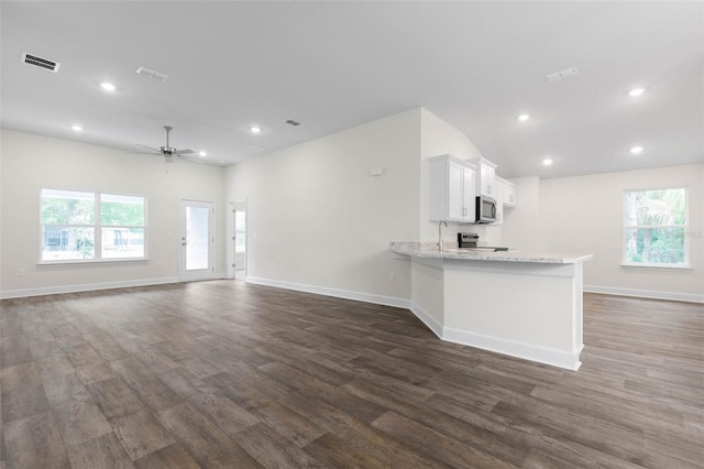 25 Port Echo Ln, Palm Coast, FL 32164 - unfurnished living room featuring dark wood-style floors, a ceiling fan, and recessed lighting