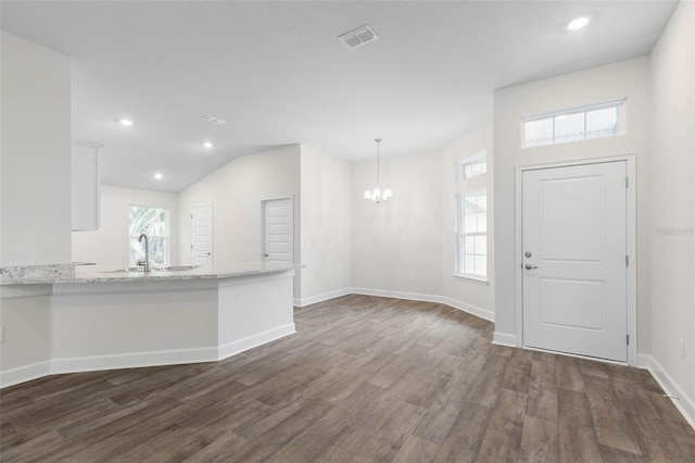 25 Port Echo Ln, Palm Coast, FL 32164 - entrance foyer featuring dark wood-type flooring, a chandelier, recessed lighting, and lofted ceiling