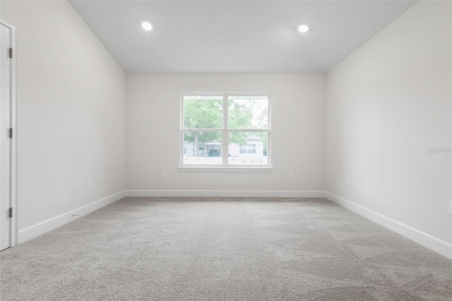 25 Port Echo Ln, Palm Coast, FL 32164 - unfurnished room with light carpet and recessed lighting