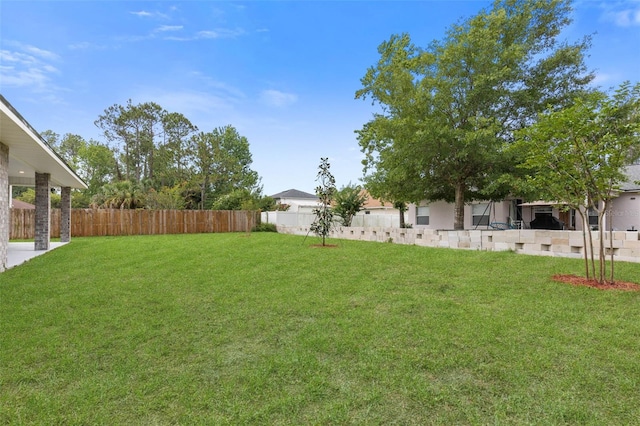 25 Port Echo Ln, Palm Coast, FL 32164 - fenced backyard with a patio