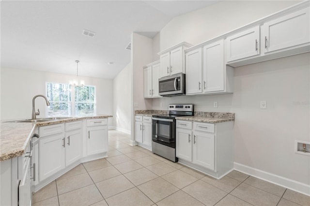 kitchen featuring sink, white cabinetry, hanging light fixtures, stainless steel appliances, and light stone countertops