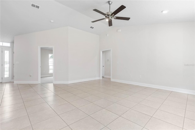 tiled spare room with ceiling fan and lofted ceiling