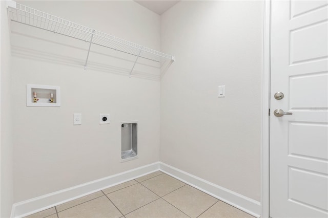 washroom with light tile patterned flooring, washer hookup, and electric dryer hookup