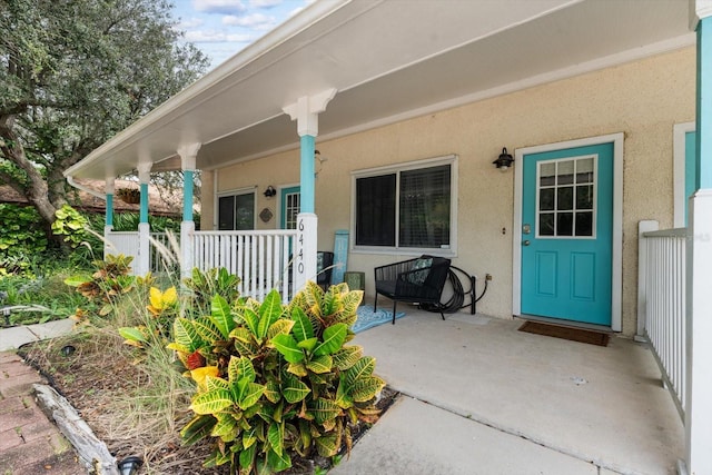 entrance to property with covered porch