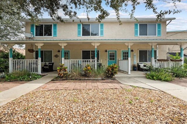 view of property with covered porch