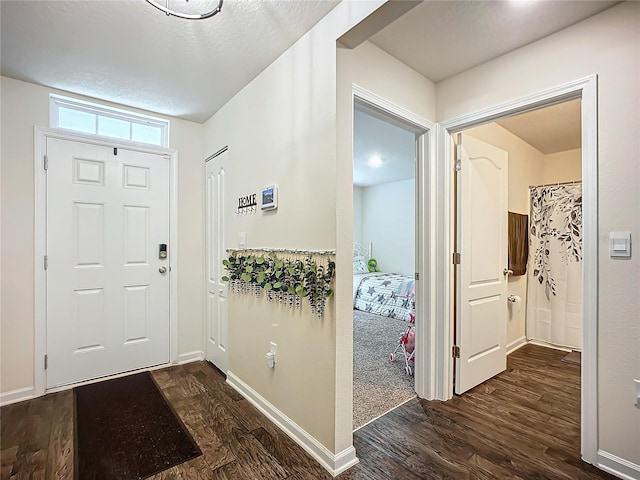 entrance foyer featuring dark hardwood / wood-style floors