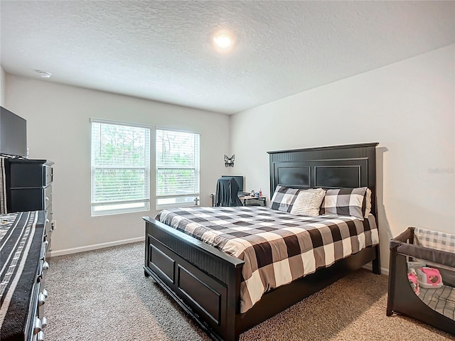 carpeted bedroom with a textured ceiling