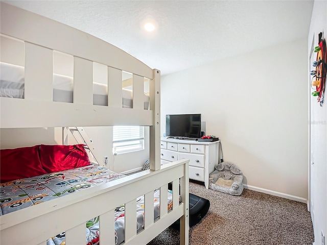 carpeted bedroom featuring a textured ceiling and lofted ceiling