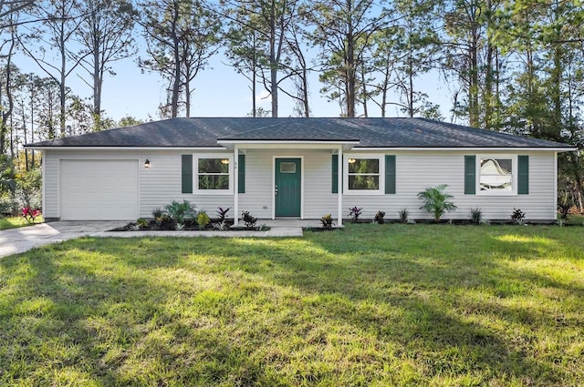 ranch-style home with a garage and a front lawn