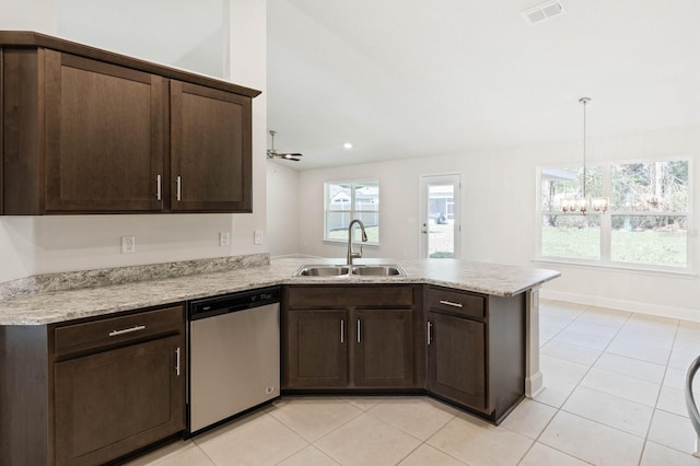 kitchen with sink, dishwasher, dark brown cabinets, light tile patterned flooring, and kitchen peninsula