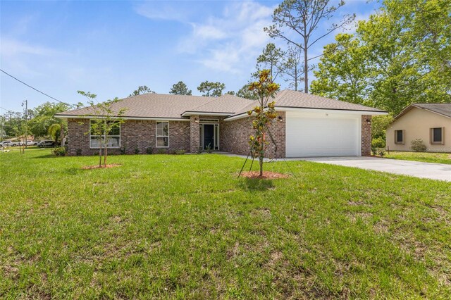 39 Zaun Trl, Palm Coast, FL 32164 - single story home with driveway, an attached garage, brick siding, and a front lawn