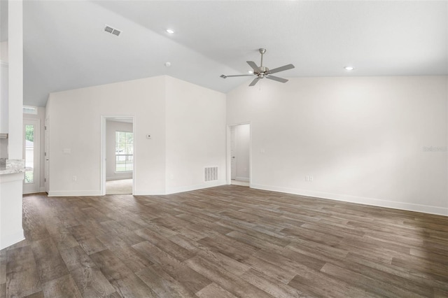 39 Zaun Trl, Palm Coast, FL 32164 - unfurnished living room featuring ceiling fan, wood finished floors, high vaulted ceiling, baseboards, and recessed lighting