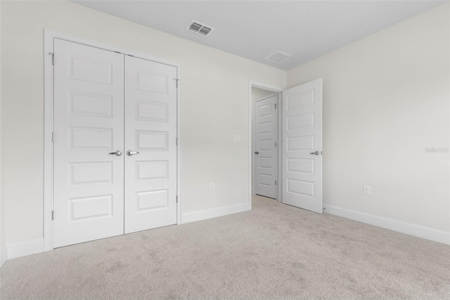 39 Zaun Trl, Palm Coast, FL 32164 - unfurnished bedroom with carpet flooring, baseboards, and a closet