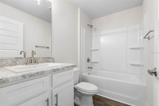 39 Zaun Trl, Palm Coast, FL 32164 - full bath featuring vanity, shower / bathtub combination, toilet, and wood finished floors