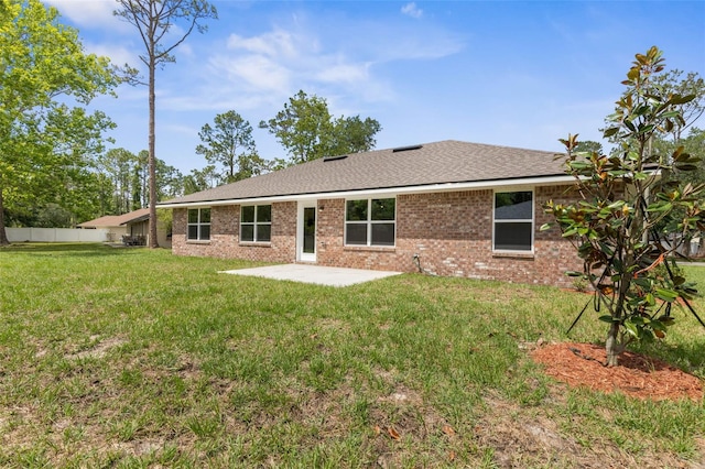 39 Zaun Trl, Palm Coast, FL 32164 - rear view of property with a patio area and brick siding
