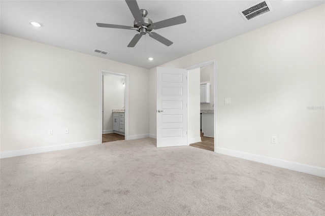 39 Zaun Trl, Palm Coast, FL 32164 - unfurnished bedroom with carpet floors, baseboards, recessed lighting, connected bathroom, and a ceiling fan